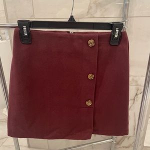 GB Girls side button mini skirt, color port, size 12
Purchased from Dillards.